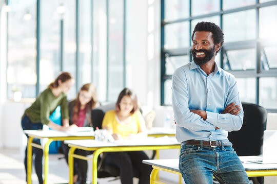 Coworking, success and black man in office with thinking, our vision and happy from web design startup. Professional, arms crossed and creative worker with confidence and proud from website admin job