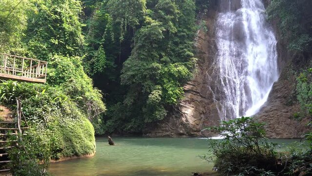 waterfall clear water and green emerald for nature relax and summer travel with tree and rock in forest at thung nang khruan waterfall 3rd floor in lam khong ngu national park with waterfall sound