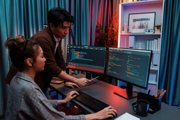 IT developers discussing with point to intelligent website development coder system running data...