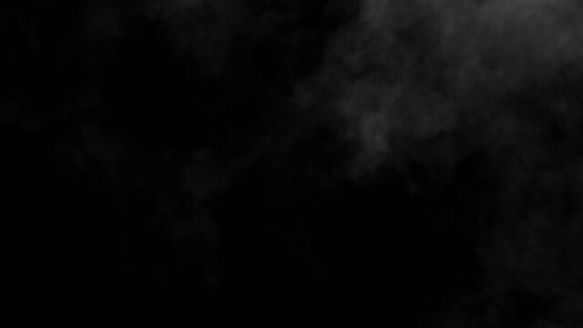Video of a large puffy smoke cloud rising through the air, 4k 30p WITH ALPHA CHANNEL for transparency