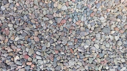 rock texture, pile of colorful pebbles and stones on the ground