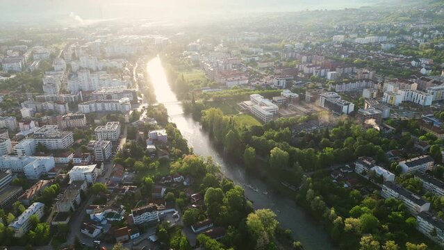 River Vrbas running through the city of Banja Luka, the capital of Republic of Srpska province, Bosnia and Herzegovina. Captivating aerial video, panoramic view.