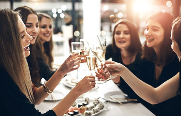 Alcohol, sushi and toast with friends at dinner party together for celebration, event or social gathering. Cheers, crowd and smile with group of happy young people at restaurant venue for bonding