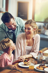 House, parents and boy with breakfast, love or happiness in kitchen, healthy meal or pancakes. Family, mother or father with kid, food or morning celebration with nutrition, wellness or care in house