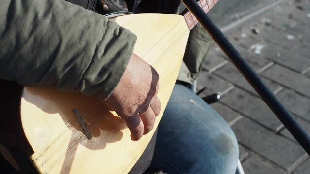  men playing traditional music instrument turkish saz 