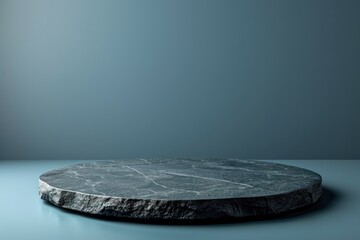 Empty black stone table top, desk or shelf isolated on dark pale blue background