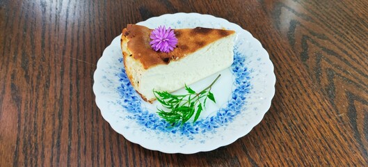 Cheese cake is a dessert cake made of cheese , eggs, and sugar. It often has a graham cracker crumb crust, sometimes held together by melted butter. The filling has a very heavy, smooth texture.
