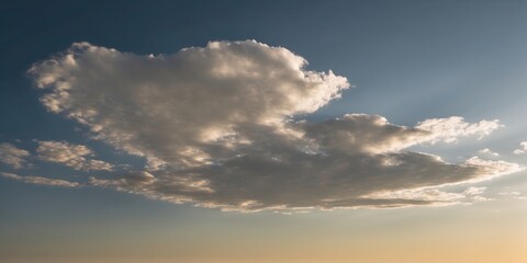 Obraz premium A captivating cloudscape showing a cloud highlighted by sunlight with darker shadows adding contrast to the scene