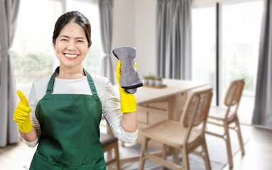 Asian housekeeper wear gloves apron