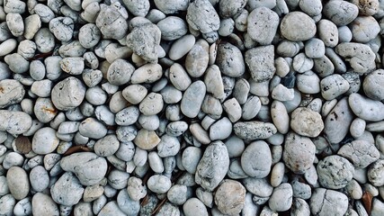 White round pebble stones background, rough texture of the stone, material for the garden decoration
