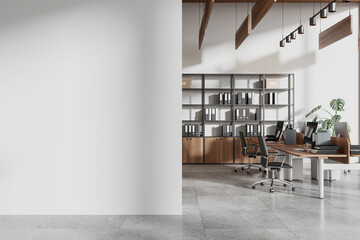 Coworking interior with pc monitors and chairs in row. Mockup wall