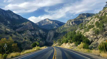 Fototapeta premium Photo of a Winding Road Through Mountain Pass
