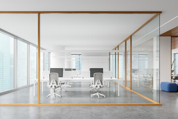 White office interior with pc computers and furniture, panoramic window