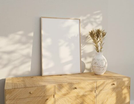 a white blank frame video mockup near white wall. The Frame ratio 5X7