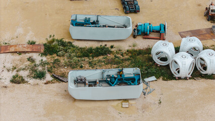 Zero carbon footprint and the European Green Deal. Wind turbine blades and spare parts waiting for...