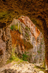 Natural window inside the Iris Grotto at the Cola de Caballo Waterfall in the Monasterio de Piedra Natural Park, Aragon