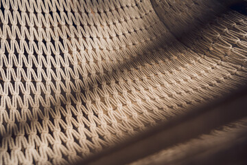 A detailed view of a knitted textile featuring a geometric design