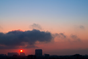 Fototapeta premium Heavy Cloud and Early Sun over the City