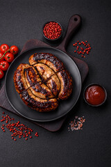 Delicious grilled sausage in the form of a ring with salt, spices