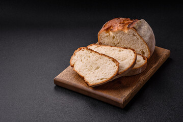 A loaf of brown bread with grains of cereals