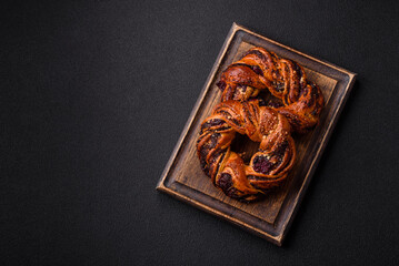 Delicious fresh baked bun with poppy seeds and berries