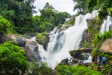 Obraz premium Landscape of peaceful waterfall in the tropical rainforest
