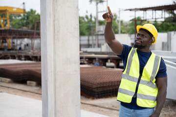African engineer man or worker finger point and working with precast cement at precast cement...