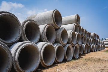 A stack of concrete ring pipes piled and creating a symmetrical arrangement