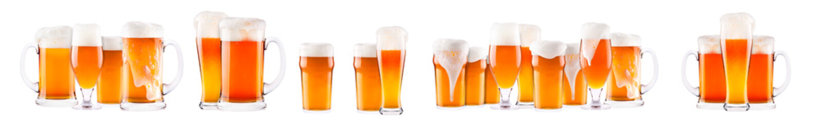 Set of fresh beer glasses with bubble froth isolated on white background.