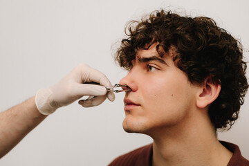 Rhinoscopy medical examination at a private ENT clinic before rhinoplasty or septoplasty surgery....