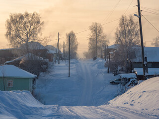 Winter slippery rural road, steep descent and ascent.