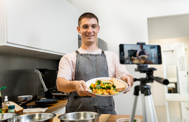 The chef is broadcasting live from workshop how to prepare a vegetarian food