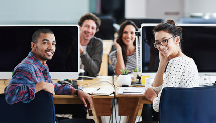 Computer, graphic design and desk with portrait of employee team in office together for creative career. Collaboration, smile for web development and happy people in workplace for project management
