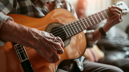 Obraz premium Close-up of a mature musician's hands playing an acoustic guitar, highlighting the connection between man and instrument.