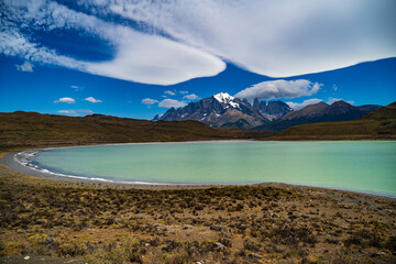 Mont Almirante Nieto and Torres del Paine behind Laguna Amarga with an interesting cloud formation.