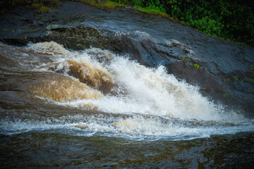 water flowing over rocks in the forest