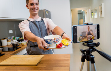 The chef is broadcasting live from workshop how to prepare a vegetarian food