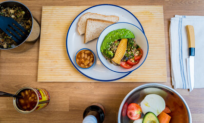 Healthy quinoa bowl with avocado, mushrooms and fresh vegetables