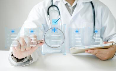 Fototapeta premium Medicine doctor use laptop to review patient medical records on virtual screens for digital healthcare. Review medical reports carefully and diagnose illnesses for an effective treatment plan.
