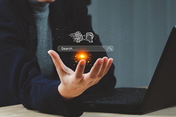 Ai tech concept, businessman with AI search engine bar for data search optimization by artificial intelligence technology.