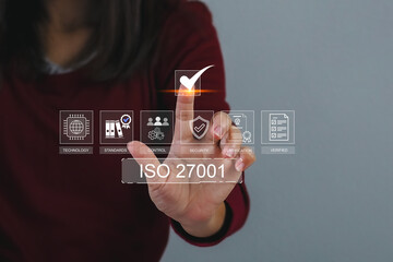 ISO 27001 concept. Businesswoman with ISO 27001 certified for information security management...