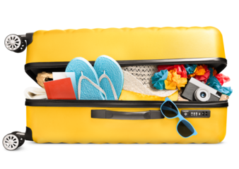 a full ajar suitcase with summer accessories, a passport and a camera lies on its side, on a white isolated background