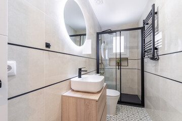 Modern bathroom interior with stylish fixtures and neutral tones