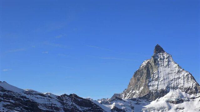 Matterhorn is a large, near-symmetric pyramidal peak in the extended Monte Rosa area of the Pennine Alps, whose summit is 4,478 metres (14,692 ft) above sea level.