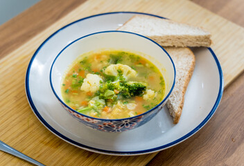 Vegetarian lentils soup with cauliflower and broccoli