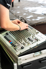 Sound engineer working with a professional sound console