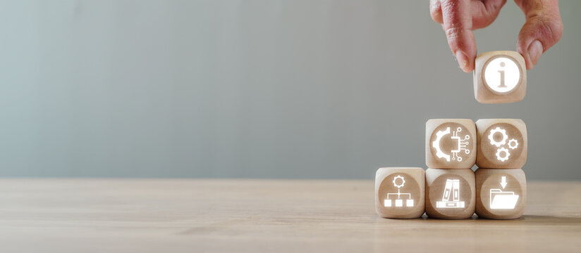 Wooden cubes with ITIL icons representing IT services, processes, and management, showcasing the concept of Information Technology Infrastructure Library.