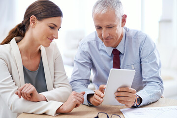Discussion, mature man and businesswoman with tablet for internet and online work for training on...
