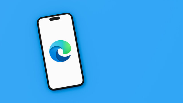 Microsoft Edge Logo on Mobile Phone Screen on Blue Background with Copy Space