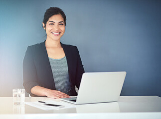 Office, portrait and business woman with laptop for typing, research and article info. Self employed, female journalist and copywriting with computer for remote work, blog post and freelancer